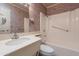 Clean bathroom with single sink vanity, bathtub and shower at 10610 W Saratoga Cir, Sun City, AZ 85351
