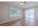 Bright bedroom with wood flooring, window shutters and ceiling fan at 10610 W Saratoga Cir, Sun City, AZ 85351