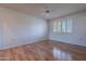 Bedroom with wood flooring, window shutters, and ceiling fan at 10610 W Saratoga Cir, Sun City, AZ 85351