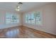 Bright den features wood floors and plantation shutters, offering natural light at 10610 W Saratoga Cir, Sun City, AZ 85351