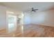 Spacious living room with wood flooring and open concept floor plan at 10610 W Saratoga Cir, Sun City, AZ 85351