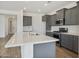 Modern kitchen island with white quartz countertop and gray cabinets at 12816 N 172Nd Dr, Surprise, AZ 85388