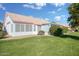 House exterior showcasing the backyard and landscaping at 14129 W Sky Hawk Dr, Sun City West, AZ 85375