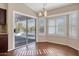 Bright dining area with sliding glass door to patio at 14129 W Sky Hawk Dr, Sun City West, AZ 85375