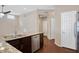 Kitchen island with granite countertop and stainless steel dishwasher at 14129 W Sky Hawk Dr, Sun City West, AZ 85375