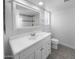 Clean bathroom with white vanity, tiled shower, and large mirror at 14221 N 39Th Dr, Phoenix, AZ 85053