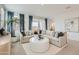 Spacious living room with beige sectional sofa and white coffee table at 15667 W Winslow Ave, Goodyear, AZ 85338