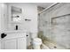 Modern bathroom with a frameless glass shower and white vanity at 1757 W Sunland Ave, Phoenix, AZ 85041