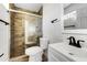 Updated bathroom with a white vanity, walk-in shower, and modern fixtures at 1757 W Sunland Ave, Phoenix, AZ 85041