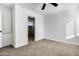 Bright bedroom with wood-look tile floors and ceiling fan at 1757 W Sunland Ave, Phoenix, AZ 85041