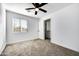 Bedroom with carpet flooring, window blinds, and a closet at 1757 W Sunland Ave, Phoenix, AZ 85041