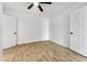 Bright bedroom with wood-look tile floors and ceiling fan at 1757 W Sunland Ave, Phoenix, AZ 85041