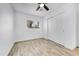 Bright bedroom with wood-look tile floors and double door closet at 1757 W Sunland Ave, Phoenix, AZ 85041