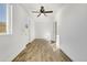 Well-lit bedroom with wood-look floors and exterior access at 1757 W Sunland Ave, Phoenix, AZ 85041