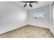 Spacious bedroom featuring wood-look tile floors and a window with blinds at 1757 W Sunland Ave, Phoenix, AZ 85041