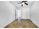 Bright bedroom with wood-look tile floors and a ceiling fan at 1757 W Sunland Ave, Phoenix, AZ 85041