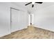 Bright bedroom with tile flooring, large closet, and ceiling fan at 1757 W Sunland Ave, Phoenix, AZ 85041