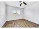 Well-lit bedroom, featuring wood-look tile floors and a ceiling fan at 1757 W Sunland Ave, Phoenix, AZ 85041