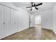 Bedroom with double door closet and wood-look floors at 1757 W Sunland Ave, Phoenix, AZ 85041