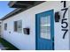 Updated home exterior with teal front door and modern house numbers at 1757 W Sunland Ave, Phoenix, AZ 85041