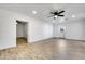 Spacious living room featuring tile floors and a ceiling fan at 1757 W Sunland Ave, Phoenix, AZ 85041