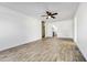 Open living room with wood-look floors and kitchen view at 1757 W Sunland Ave, Phoenix, AZ 85041