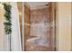 Shower with tile surround, built-in bench and shelving at 18012 N 55Th St, Scottsdale, AZ 85254