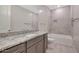 Bathroom with granite countertop and large bathtub at 18322 W Long Lake Rd, Goodyear, AZ 85338