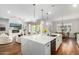 Open concept kitchen with large island, stainless steel appliances, and white cabinetry at 1935 W El Cortez Trl, Phoenix, AZ 85085