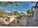 Built-in outdoor kitchen with grill and prep space at 20834 W Western Dr, Buckeye, AZ 85396