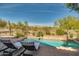 Stunning pool with patio furniture and mountain backdrop; ideal for outdoor enjoyment at 20834 W Western Dr, Buckeye, AZ 85396