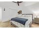 Bedroom with double bed, dresser, and ceiling fan at 21002 N Totem Dr, Sun City West, AZ 85375