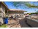 Relaxing patio area with seating and desert landscaping at 21002 N Totem Dr, Sun City West, AZ 85375