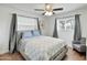 Comfortable bedroom with ceiling fan and gray color scheme at 2319 E Glenrosa Ave, Phoenix, AZ 85016