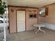 Small storage shed with table and chairs on patio at 2528 E Mckellips Rd # 131, Mesa, AZ 85213