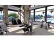 Modern fitness center with cardio and strength training equipment, plus views of the pool at 25301 N 167Th Dr, Surprise, AZ 85387