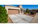 One story home with a two-car garage and nicely landscaped front yard at 2826 W Hidalgo Ave, Phoenix, AZ 85041