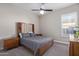 Serene bedroom featuring a wooden bed frame and window shutters at 3403 E Aloe Dr, Chandler, AZ 85286