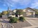 Single-story home with desert landscaping and a two-car garage at 3575 N Colonial Ct, Florence, AZ 85132