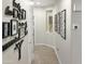 Bright hallway with tile flooring and decorative wall art at 3575 N Colonial Ct, Florence, AZ 85132