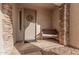 Front entry with stone columns, a bench, and a wreath on the door at 4040 E Jude Ln, Gilbert, AZ 85298