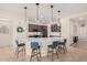 Modern kitchen with curved island, stainless steel appliances, and blue barstools at 4040 E Jude Ln, Gilbert, AZ 85298