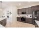 Modern kitchen with gray cabinets, white backsplash, and stainless steel appliances at 4040 E Jude Ln, Gilbert, AZ 85298