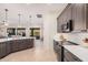 Modern kitchen island with gray cabinets and white countertops at 4040 E Jude Ln, Gilbert, AZ 85298