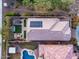 Aerial view of house featuring backyard oasis with pool, spa, and solar panels at 4235 W Palace Station Rd, New River, AZ 85087