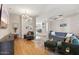 Open living room with hardwood floors, comfortable seating, and natural light at 4842 E Charleston Ave, Scottsdale, AZ 85254