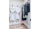 Organized closet with hanging clothes and shelving at 6711 E Camelback Rd # 56, Scottsdale, AZ 85251