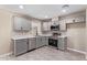 Updated kitchen featuring gray cabinets, quartz countertops, and stainless steel appliances at 6802 N 30Th Ave, Phoenix, AZ 85017