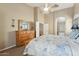 Main bedroom with large dresser and ensuite bathroom at 6818 W Nancy Ln, Laveen, AZ 85339