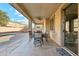 Covered patio with dining furniture and pool view at 6818 W Nancy Ln, Laveen, AZ 85339